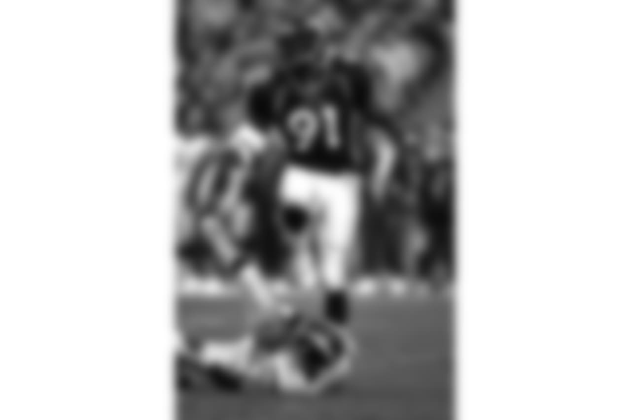 Denver: Alfred Williams sacks the Chargers quarterback during the last regular season game of the year against the San Diego Chargers at Mile High Stadium in Denver, CO on December 21, 1997.