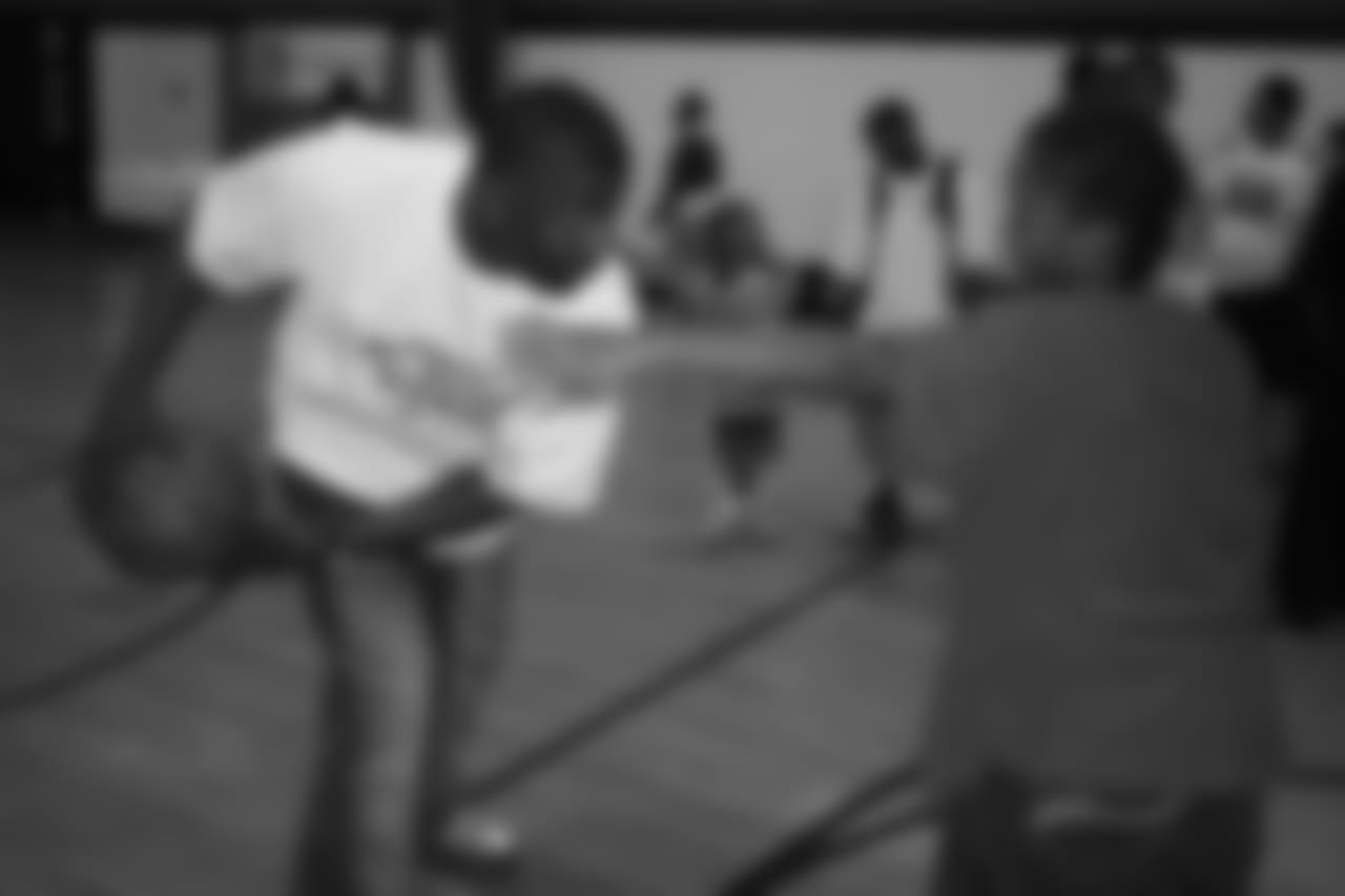 Rod Smith plays basketball with a member of the Denver Broncos Boys & Girls Club at the ceremony for the grand opening of the Darrent Williams Memorial Teen Center in 2007.