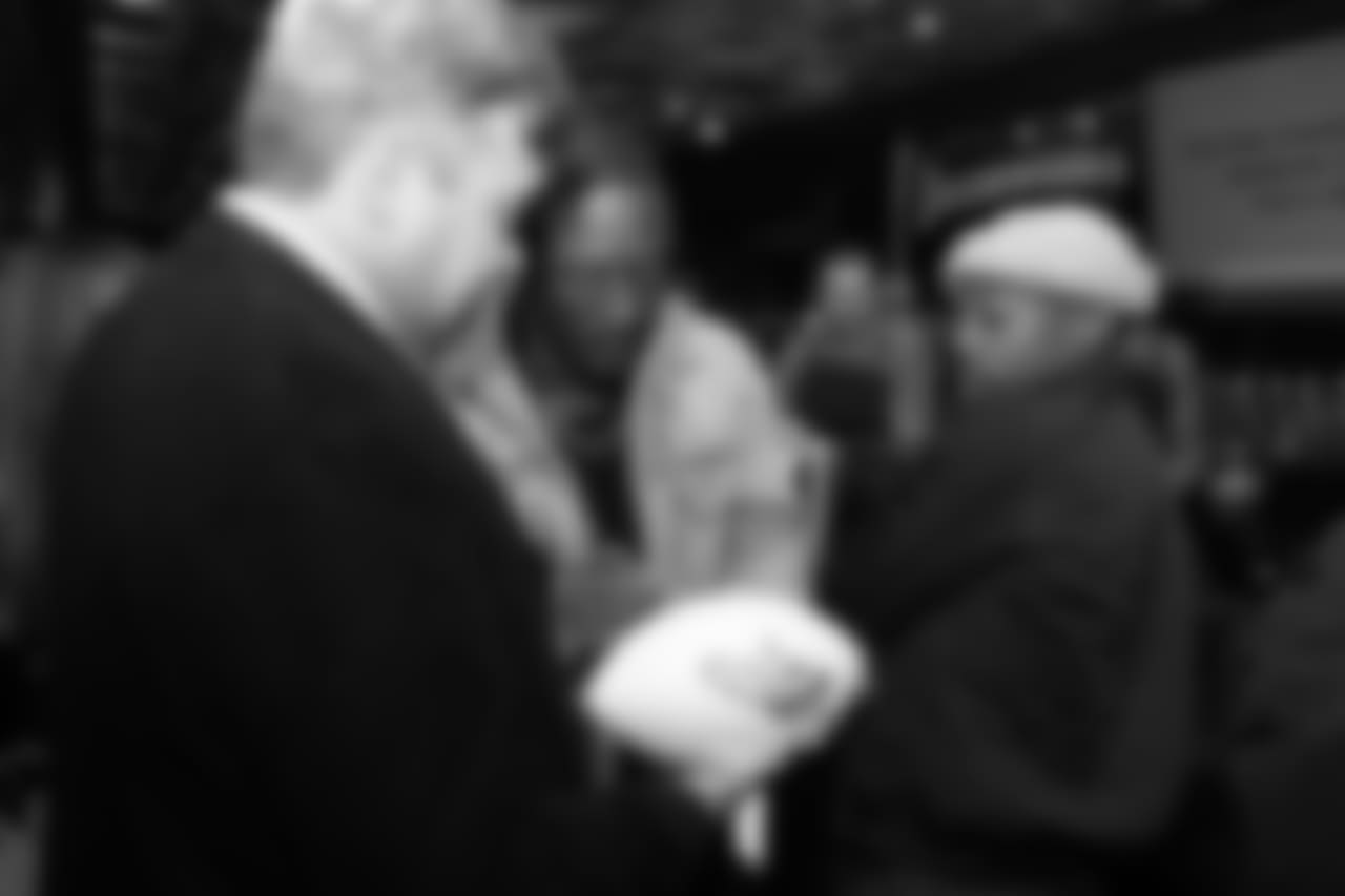 Will Parks signs a football during Von's Vision at Mile High Station in Denver on November 5, 2018.