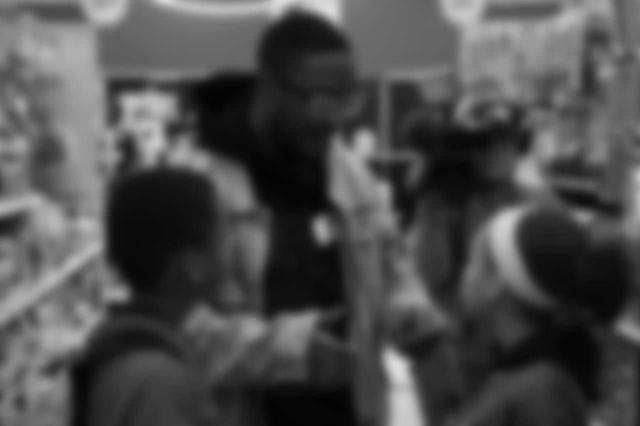 Will Parks talks with a participant during Will Parks' shopping spree for the Boys & Girls Club of Metro Denver on Dec. 3, 2018