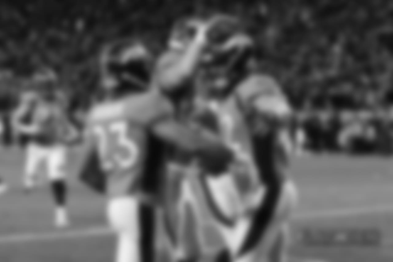 Denver Broncos fullback Andy Janovich (32) celebrates his touchdown with teammates during the fourth quarter ofthe NFL game against the Los Angeles Chargers, Sunday, December 30, 2018, in Denver. (Photo: © Eric Lars Bakke)