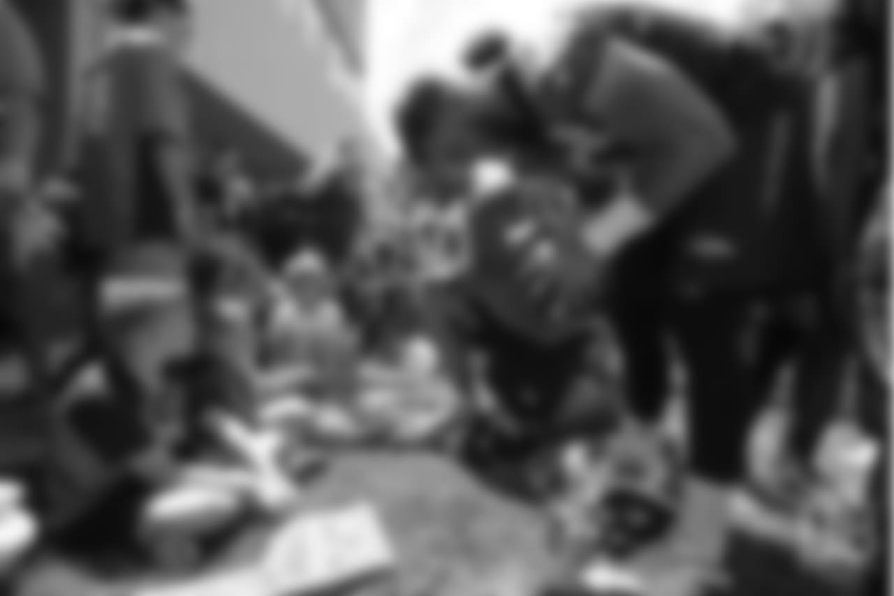 tight end Jake Butt (80) meets patients from Children's Hospital Colorado's burn unit after the final day of OTAs on June 7, 2018 at UCHealth Training Center.