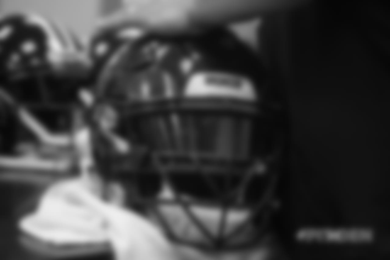 Inside the Broncos' equipment room as staffers transition helmets to the team's Color Rush set, applying new decals and throwback logos for the team's Week 12 game.