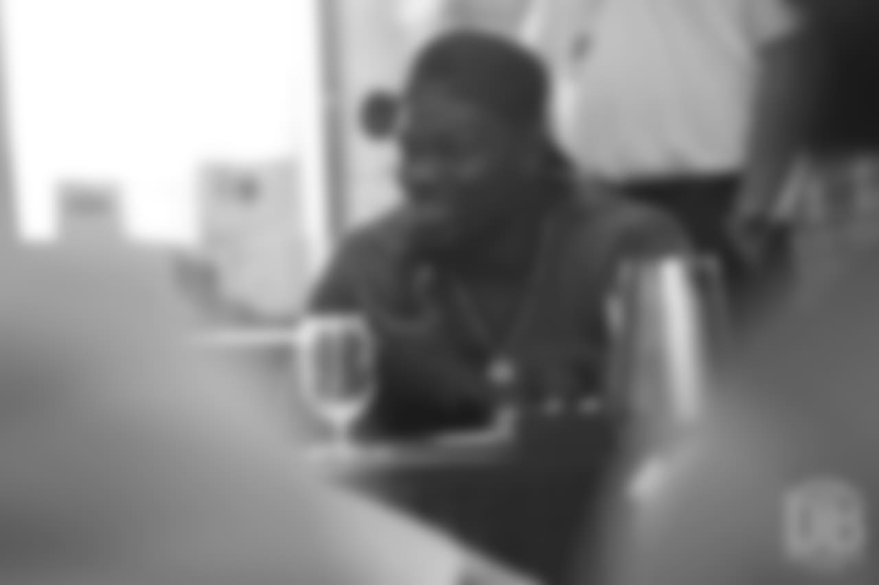 Shaquil Barrett reviews player film at Von Miller's Pass Rush Summit, which included hands-on instruction and drills, on June 28, 2018.