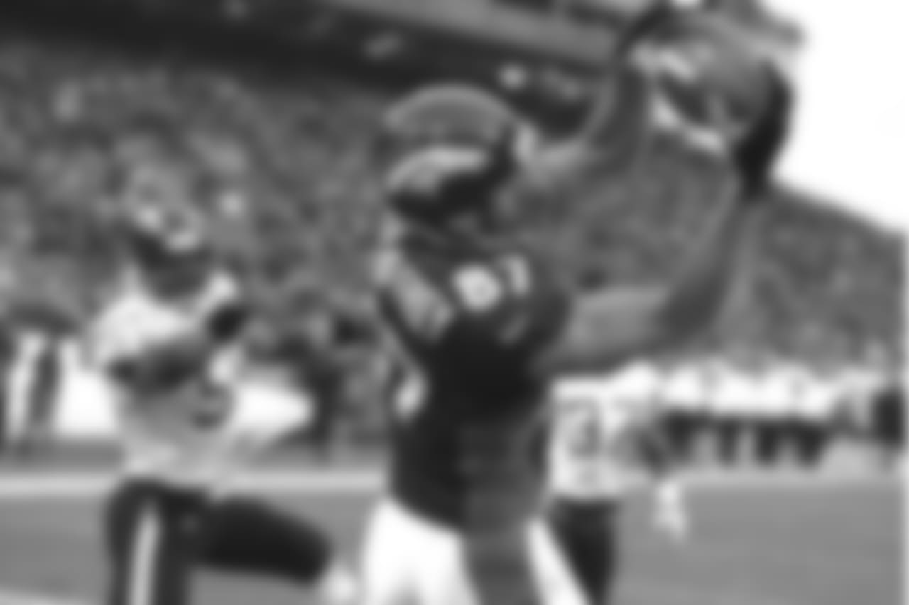 Ed McCaffrey makes a touchdown reception in the back of the endzone against the San Diego Chargers at Mile High Stadium in Denver, CO on November 8, 1998.