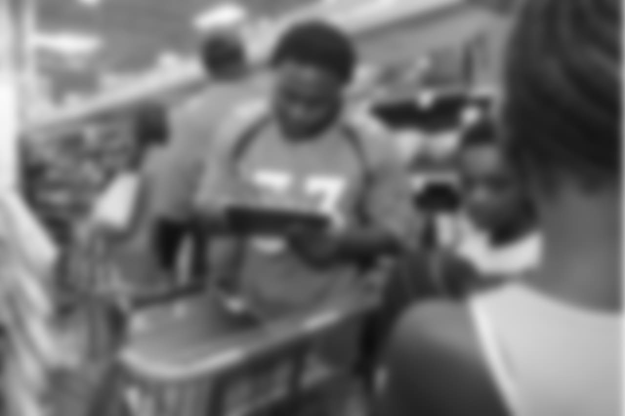 Running back De'Angelo Henderson Sr. (33) at the 2018 Back to School with the Broncos shopping spree on July 23, 2018. Each student received $100 for school supplies.