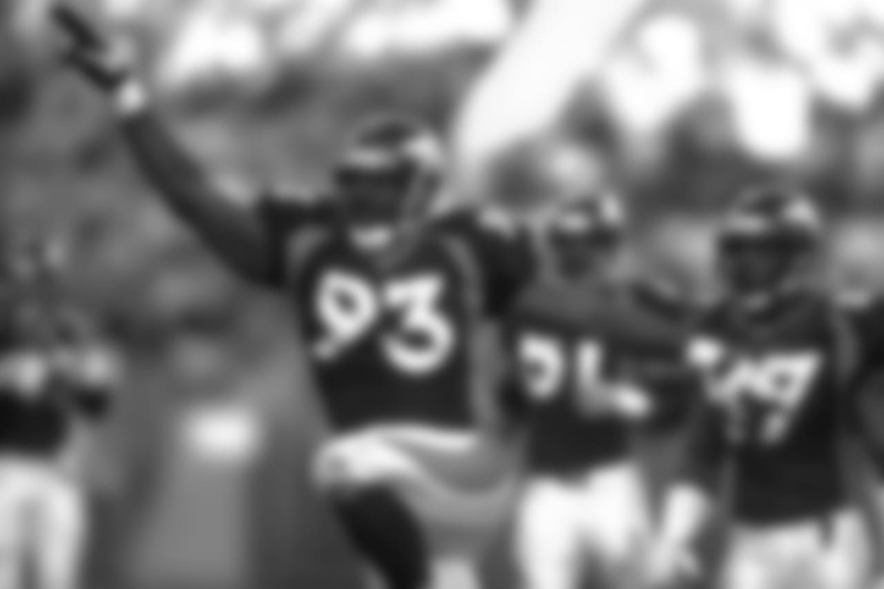 Denver: Trevor Pryce does a dance after making a tackle during the last regular season home game of the year against the San Diego Chargers at Mile High Stadium in Denver, CO on December 21, 1997.