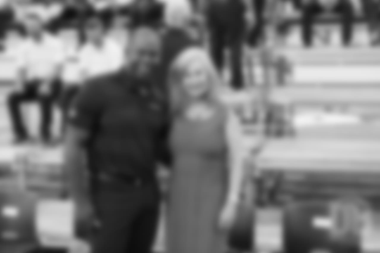 Head Coach Vance Joseph and Annabel Bowlen at team photo day at UCHealth Training Center on September 15, 2018.