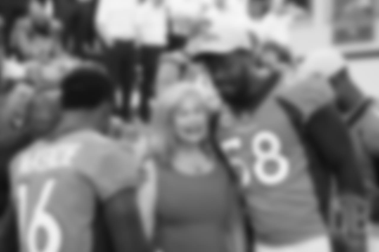 Von Miller greets Annabel Bowlen at team photo day at UCHealth Training Center on September 15, 2018.