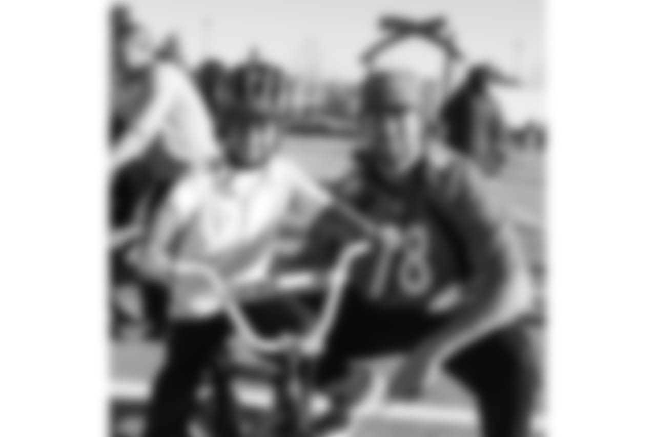 Dan Skipper and a bike recipient during a bike distribution at Green Valley Elementary School in Denver on December 18, 2018.
