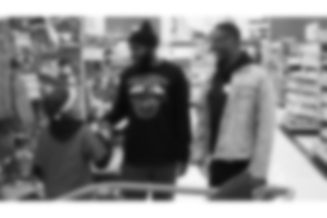 Darian Stewart greets a participant alongside Will Parks during Will Parks' shopping spree for the Boys & Girls Club of Metro Denver on Dec. 3, 2018