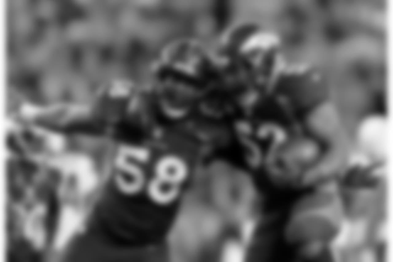 Von Miller (58) and Wesley Woodyard (52) celebrate after Miller caused a fumble and Woodyard recovered it during third-quarter action against the San Diego Chargers on Sunday, Nov. 18, 2012 at Sports Authority Field at Mile High in Denver, Colorado.
(Photo by: Gabriel Christus)