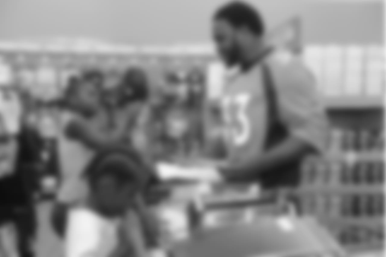 Running back De'Angelo Henderson Sr. (33) at the 2018 Back to School with the Broncos shopping spree on July 23, 2018. Each student received $100 for school supplies.