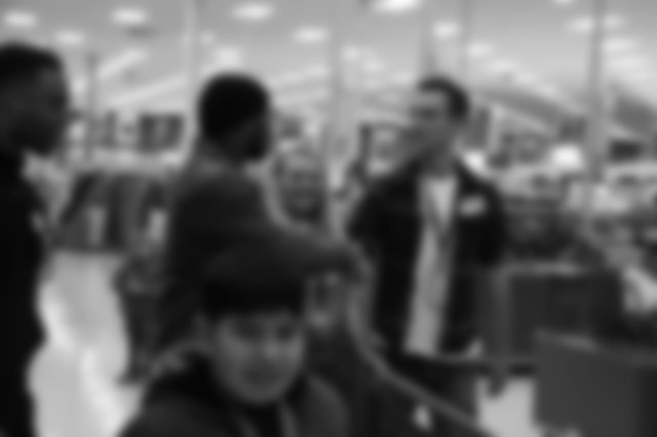 Keishawn Bierria greets a volunteer during Will Parks' shopping spree for the Boys & Girls Club of Metro Denver on Dec. 3, 2018