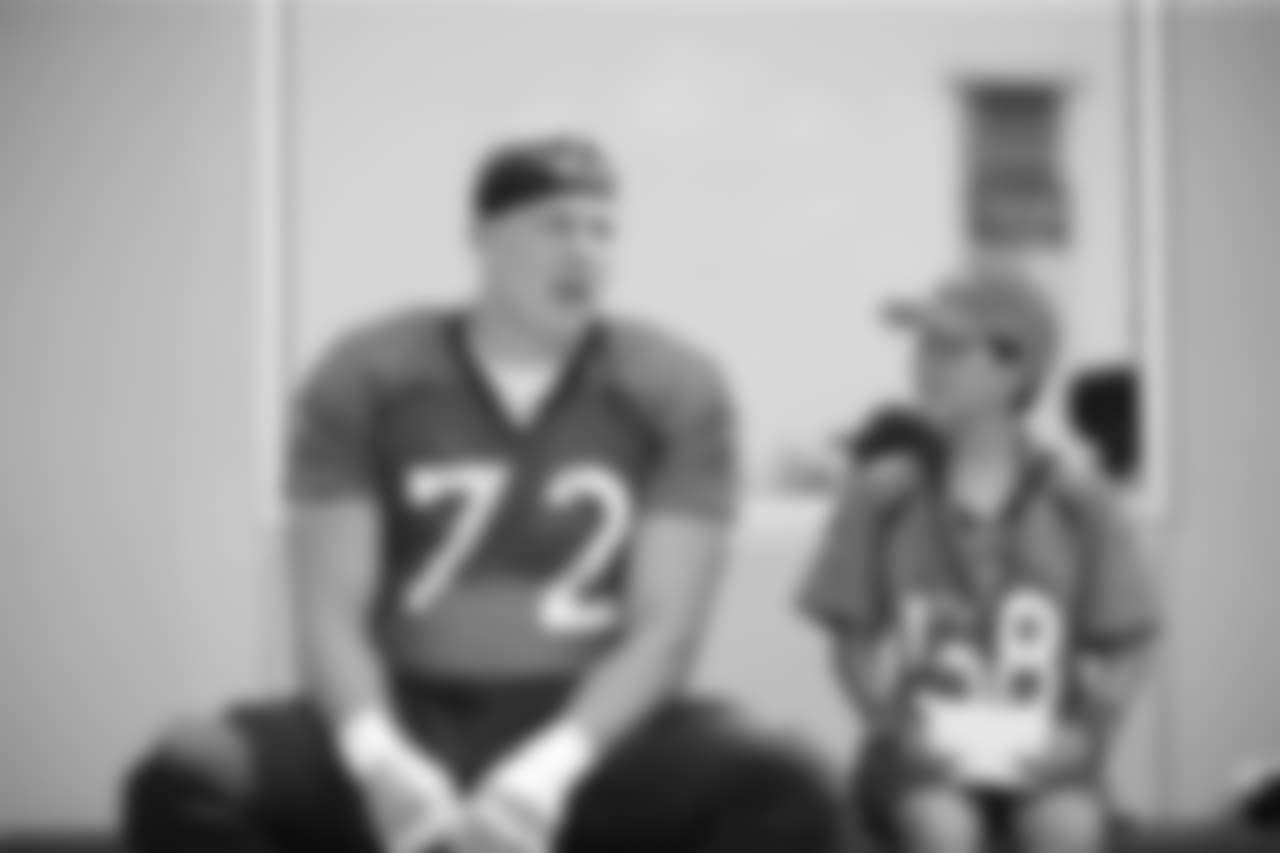 Garett Bolles with Children's Hospital Colorado Junior Reporter Nate during training camp on August 14, 2018.