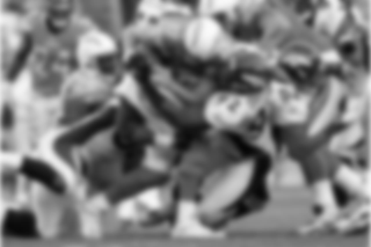 Denver Broncos Von Miller and Elvis Dumervil sack Chargers QB Philip Rivers on Nov. 27, 2011.