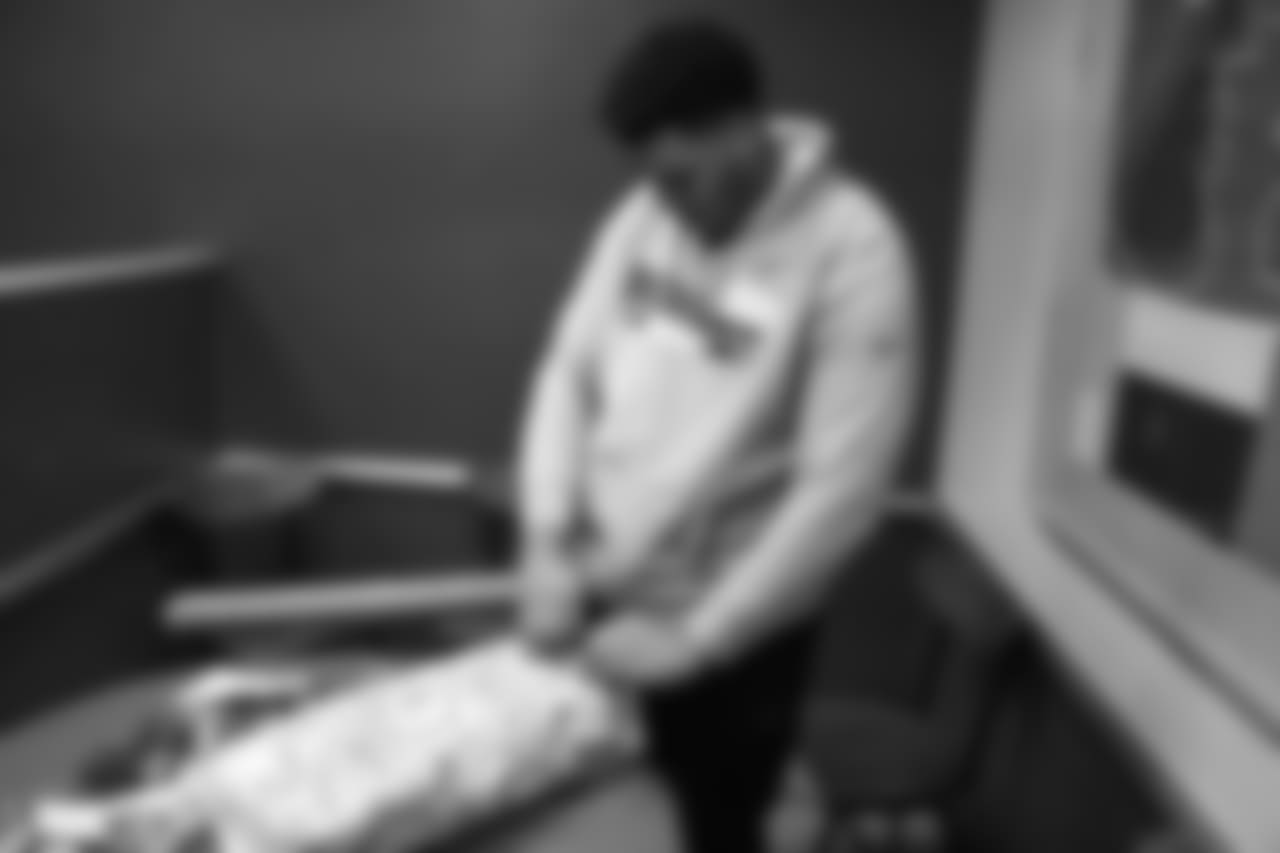 Elijah Wilkinson wraps a gift during Will Parks' shopping spree for the Boys & Girls Club of Metro Denver on Dec. 3, 2018