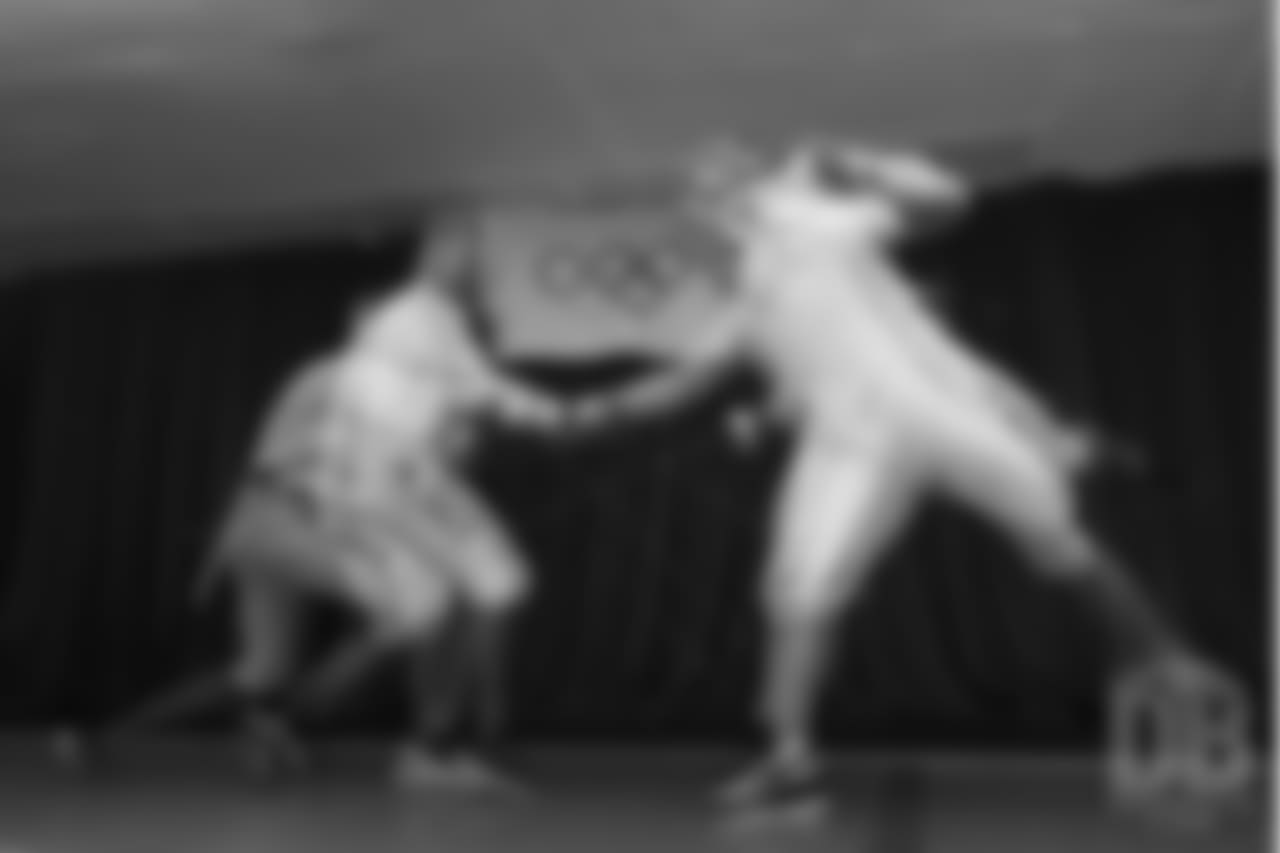 Brandon McManus and Casey Kreiter try their hands at fencing at the Denver Fencing Center on July 17, 2018.