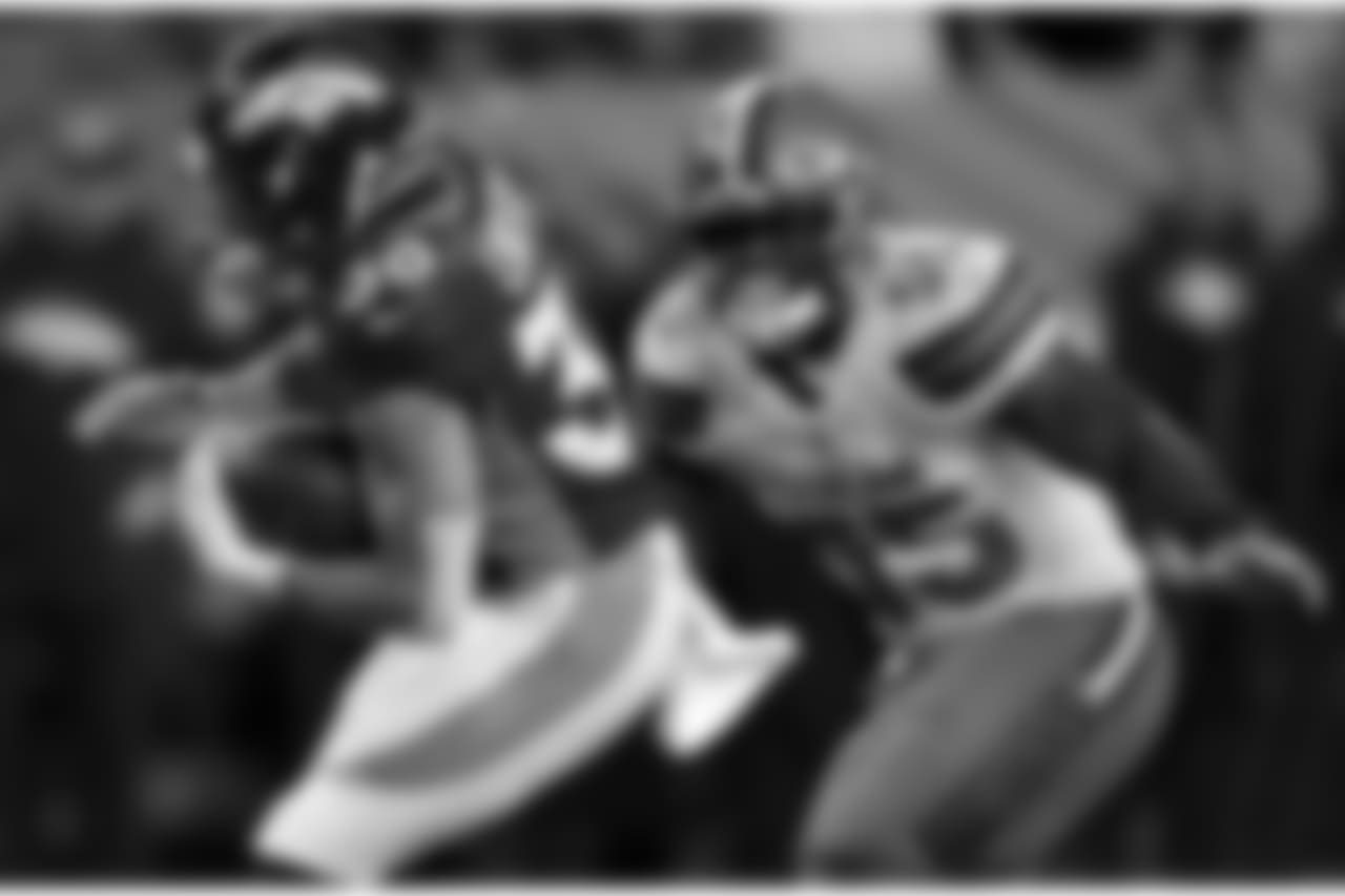 Denver Broncos running back Phillip Lindsay (30) tries to elude Cleveland Browns outside linebacker Genard Avery (55) during the first half of an NFL football game, Saturday, Dec. 15, 2018, in Denver. (AP Photo/David Zalubowski)