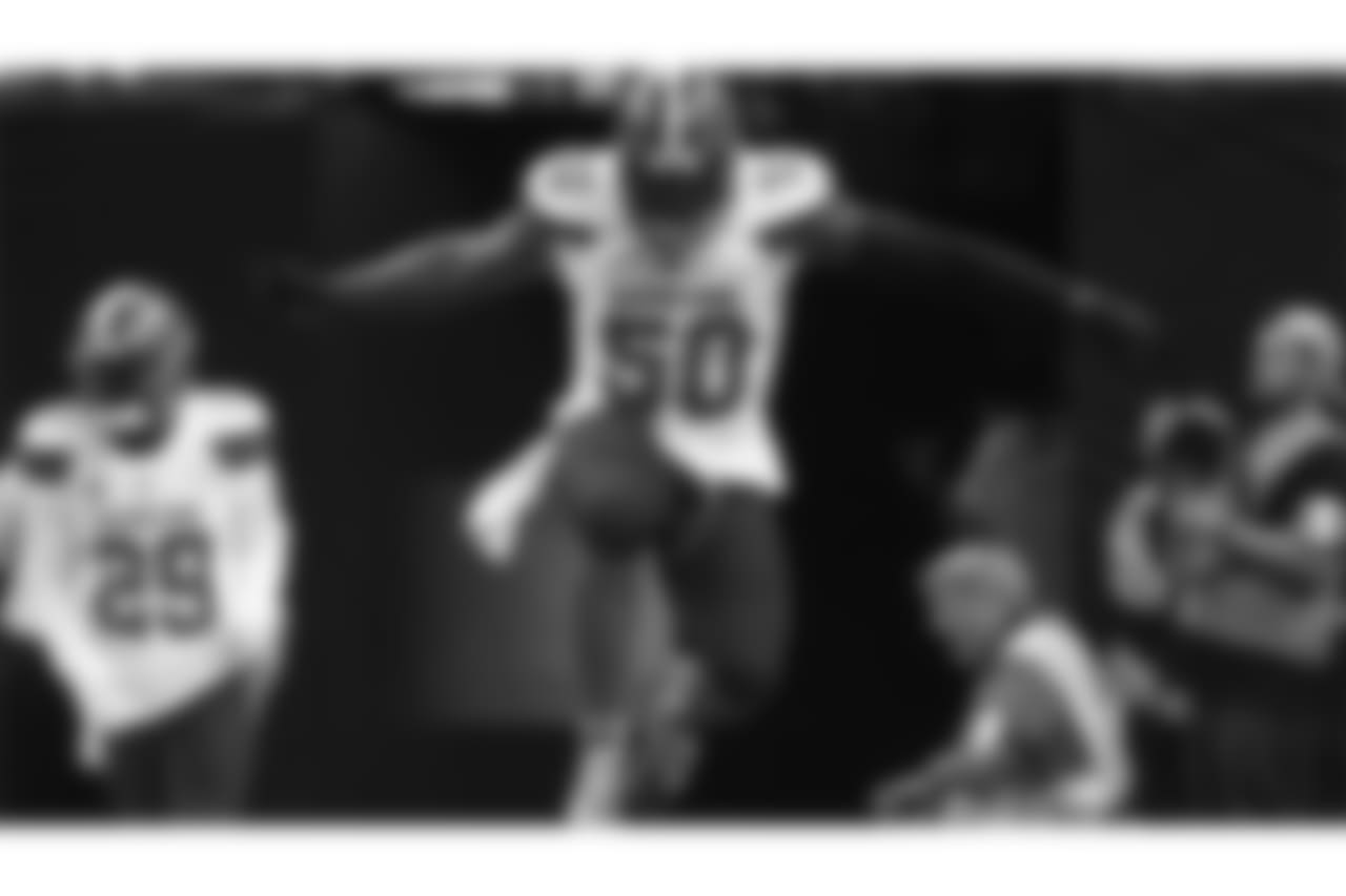 Cleveland Browns defensive end Chris Smith (50) warms up before an NFL football game against the New Orleans Saints in New Orleans, Sunday, Sept. 16, 2018. (AP Photo/Butch Dill)