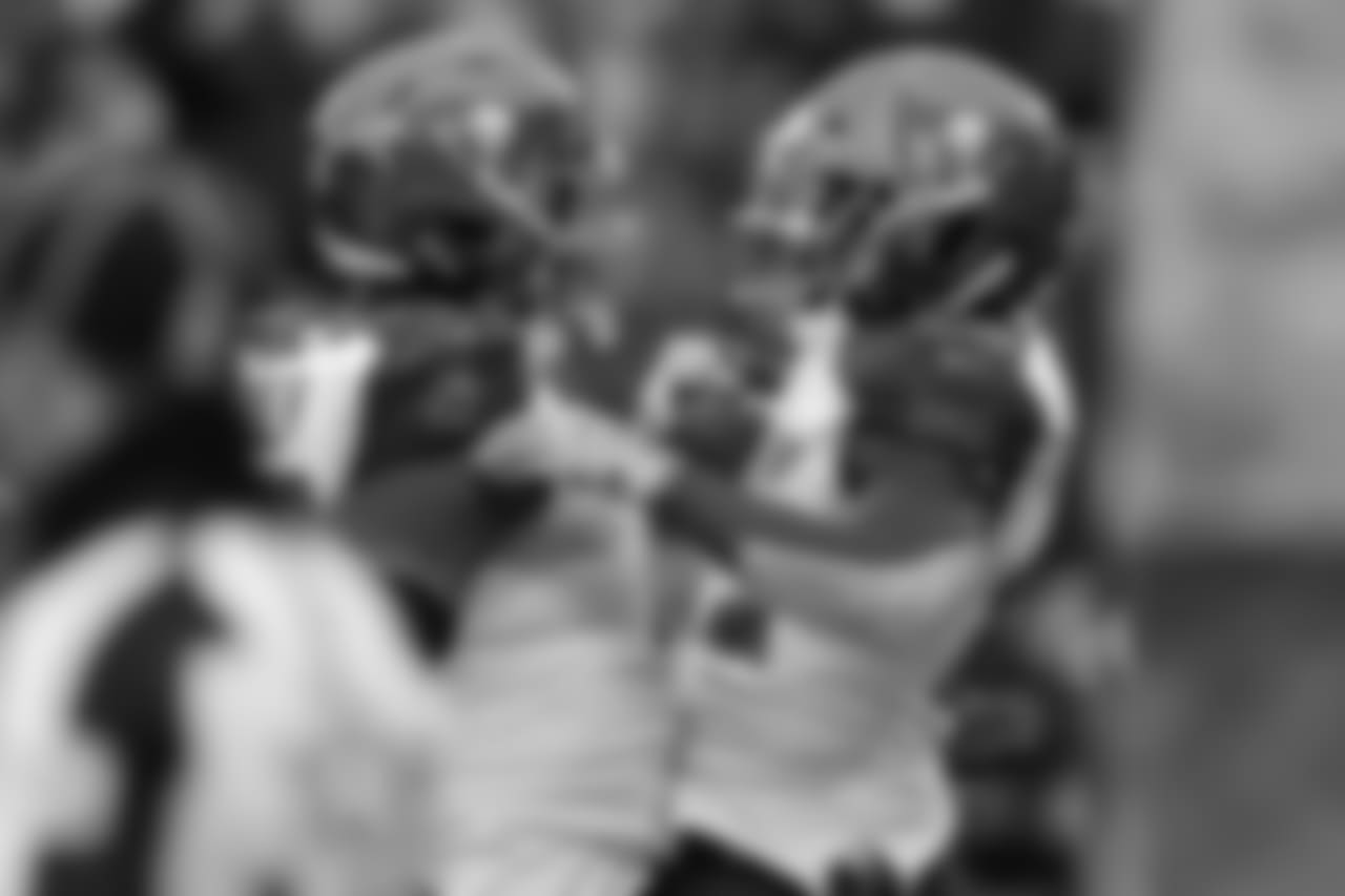 RB Peyton Barber, No. 25 and OL Caleb Benenoch, No. 77