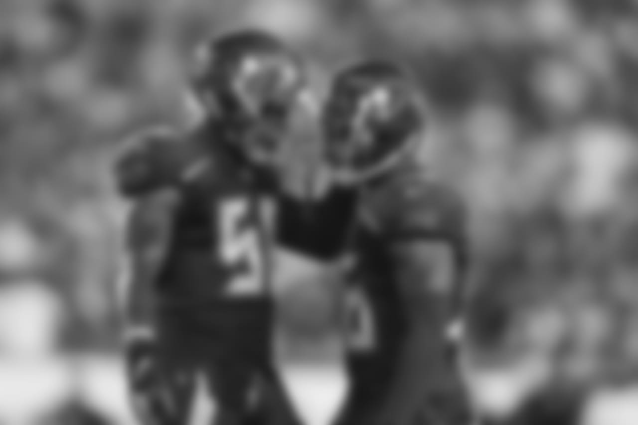 DT Jerel Worthy, No. 56 and CB M.J. Stewart, No. 36