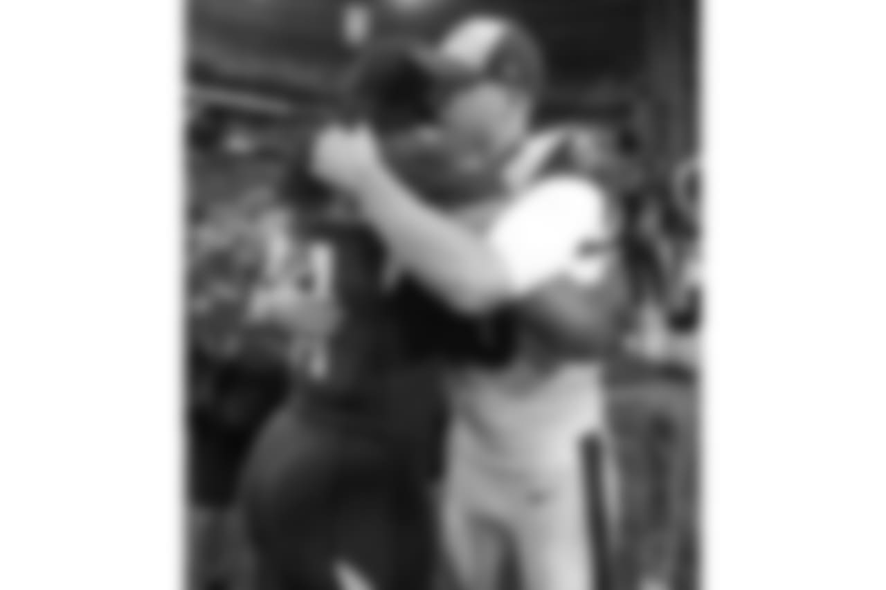Arizona Cardinals wide receiver Larry Fitzgerald greets Los Angeles Rams quarterback Jared Goff after an NFL football game, Sunday, Dec. 23, 2018, in Glendale, Ariz. The Rams won 31-9.