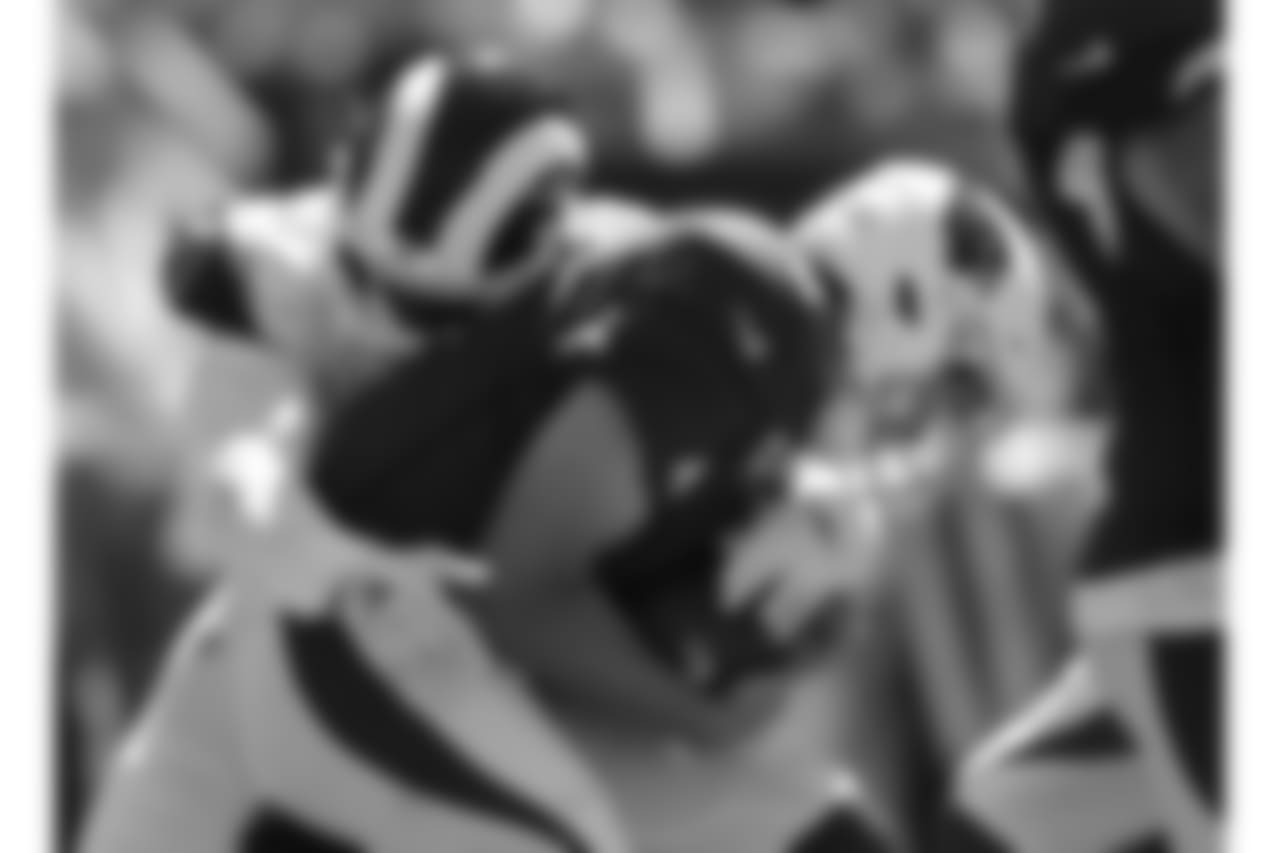 Cardinals QB Sam Bradford gets sacked by Rams LB Samson Ebukam during the first half.