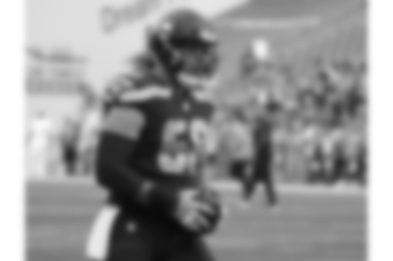 Seattle Seahawks center Justin Britt carries the ball during warmups before an NFL football preseason game against the Oakland Raiders, Thursday, Aug. 30, 2018, in Seattle. (AP Photo/Elaine Thompson)