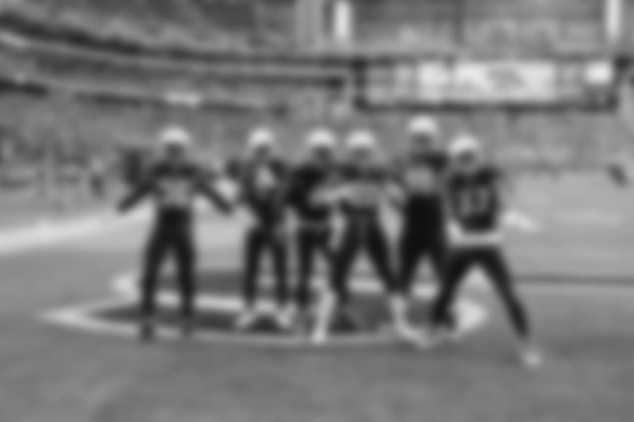 The defense celebrates an early turnover