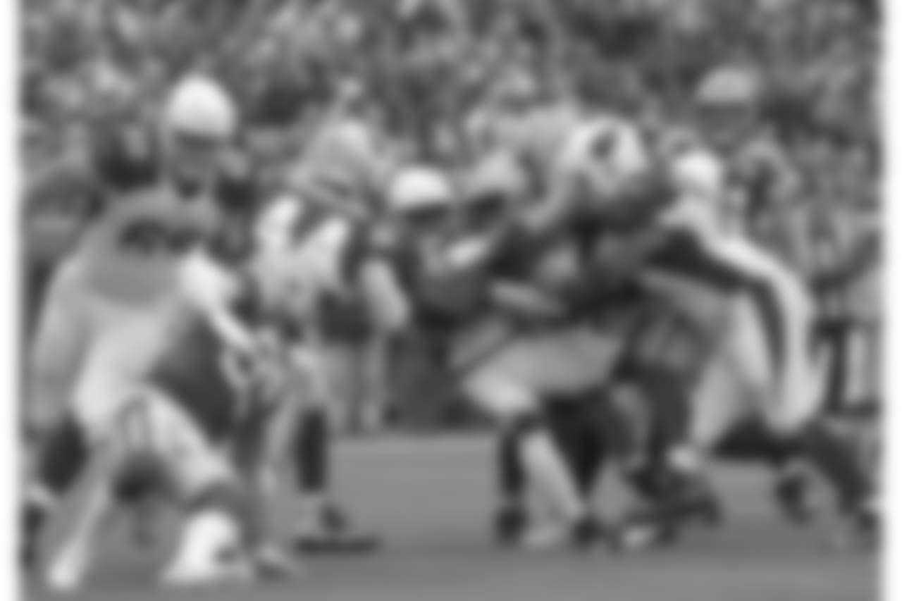 Arizona Cardinals running back Chase Edmonds is hit on a rushing play during the first half of an NFL football game against the Green Bay Packers Sunday, Dec. 2, 2018, in Green Bay, Wis.