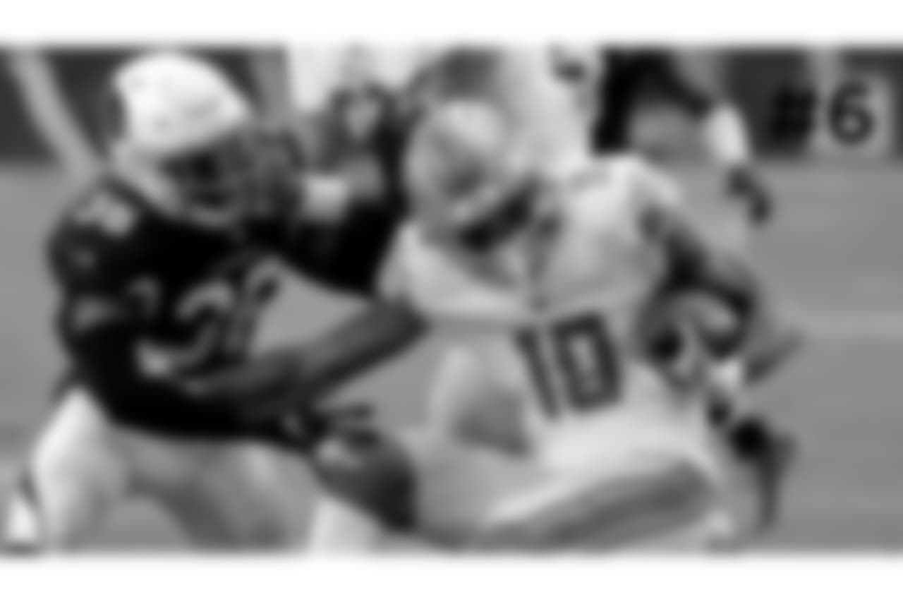 6\. Lions wide receiver Kenny Golladay is hit by Cardinals safety Budda Baker