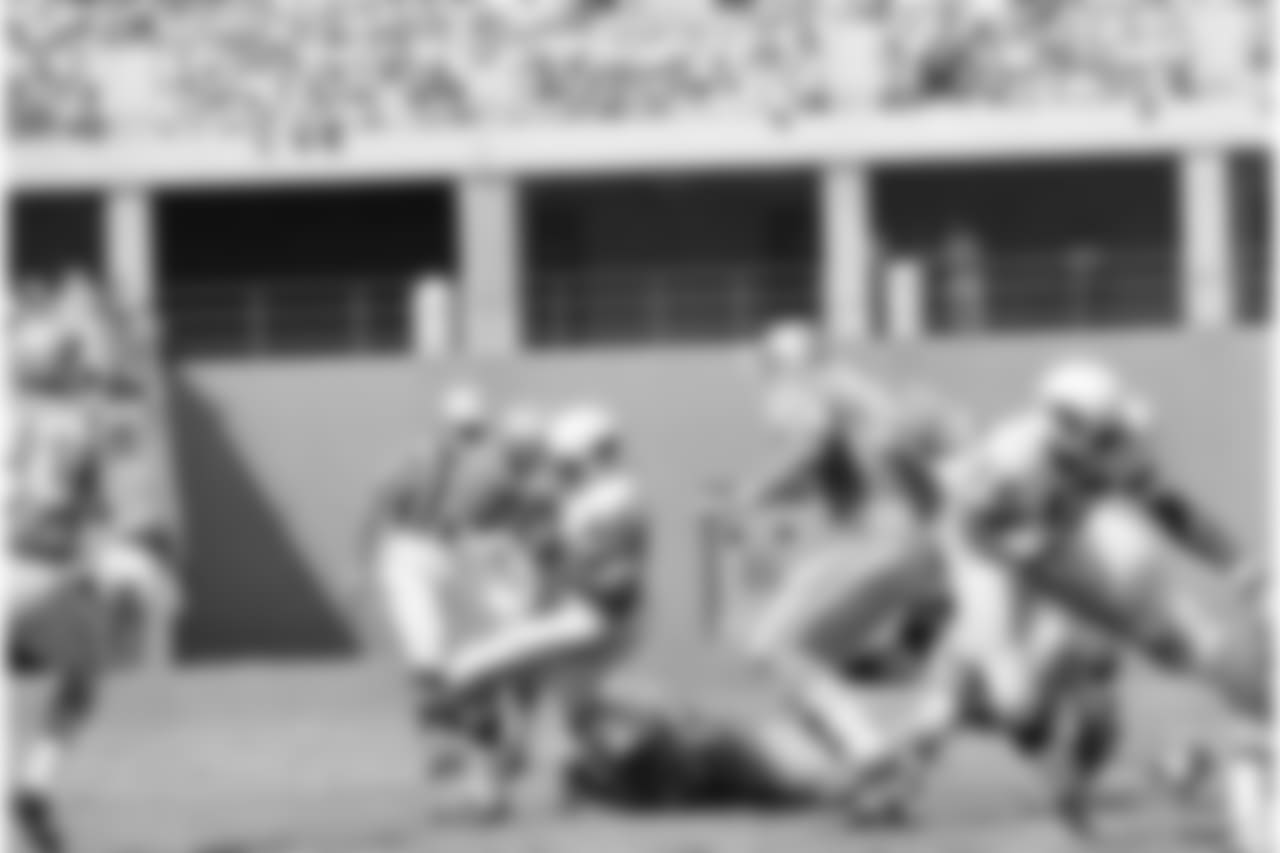 The Cardinals Johnny Roland gained only one yard on this second quarter play against the Lions, Sunday, Oct. 1, 1967, St. Louis, Mo. Detroiters are Wayne Walker (55), Mike Lucci, ground, and Darris McCord, rear. Cards won 38-28.