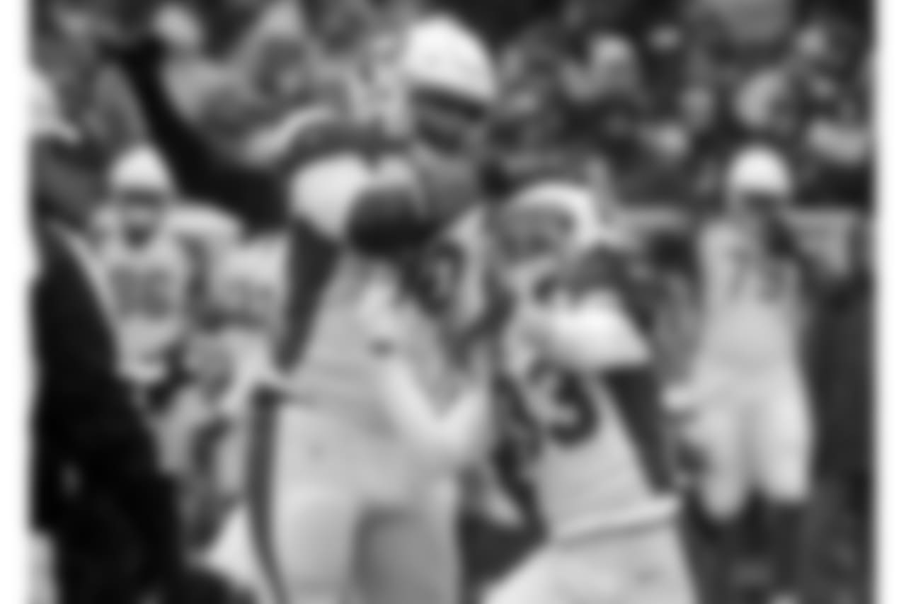 Arizona Cardinals defensive back Tre Boston (33) and defensive tackle Robert Nkemdiche (90) celebrate after a play against the Green Bay Packers during the first half of an NFL football game Sunday, Dec. 2, 2018, in Green Bay, Wis.