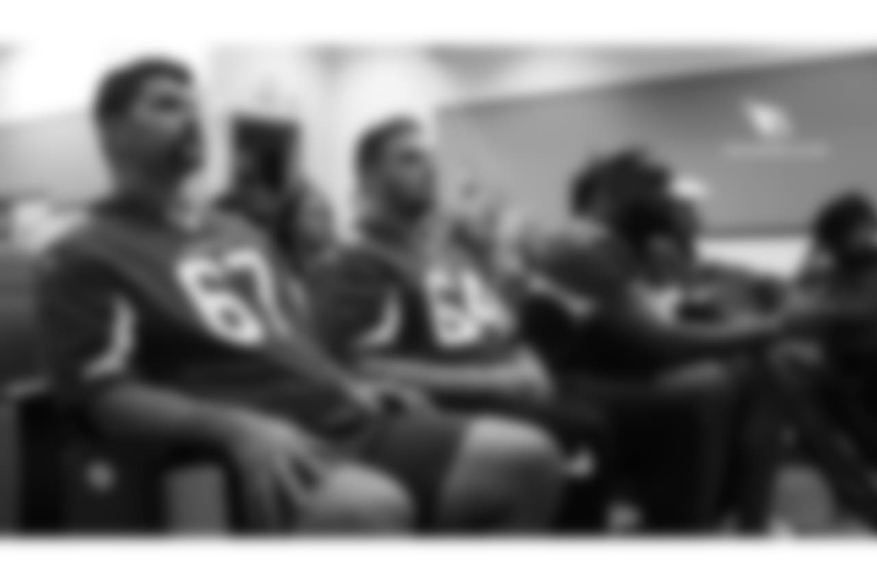 G Justin Pugh (left), C Mason Cole (center) and T Korey Cunningham listen to a presentation at Luke Air Force Base