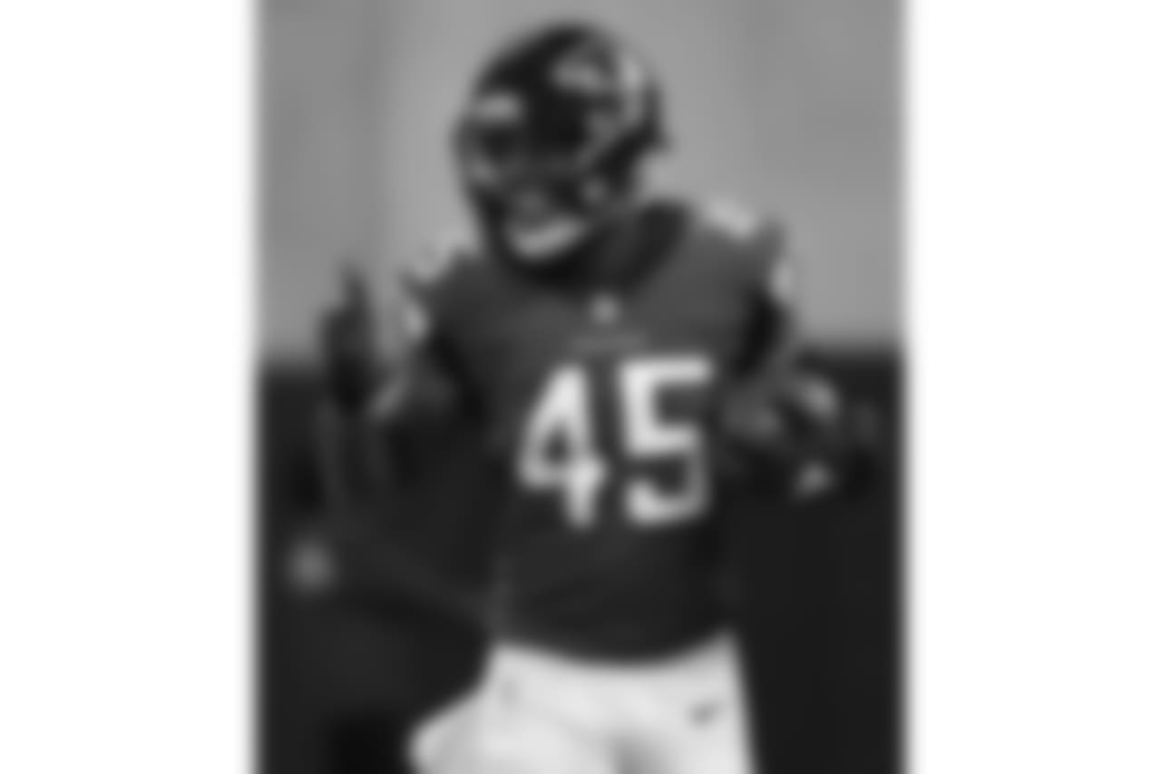 Atlanta Falcons linebacker Deion Jones (45) runs back to the bench after he intercepted the ball and ran it in for a touchdown against the Arizona Cardinals during the first half of an NFL football game, Sunday, Dec. 16, 2018, in Atlanta.