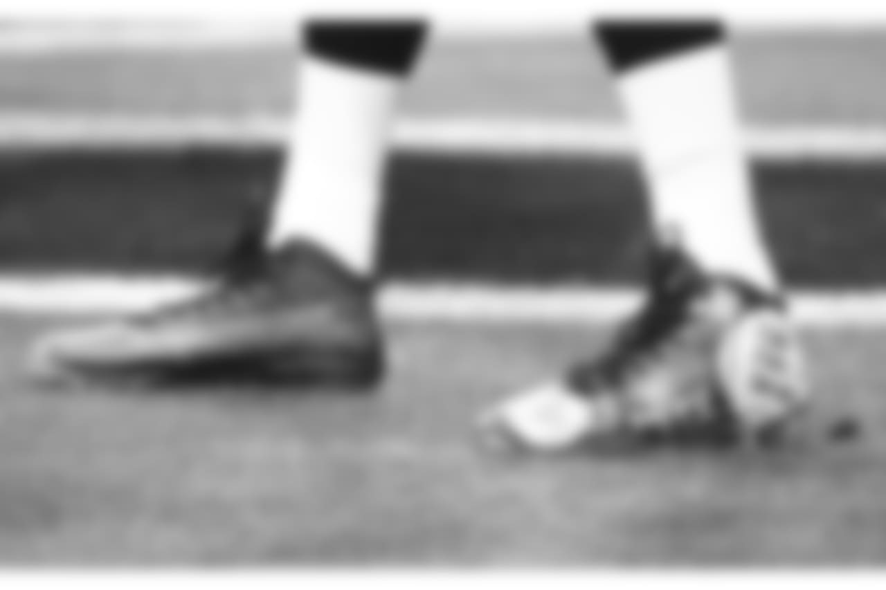 Arizona Cardinals quarterback Mike Glennon wears cleats in support of ALS research prior to an NFL football game against the Detroit Lions, Sunday, Dec. 9, 2018, in Glendale, Ariz.