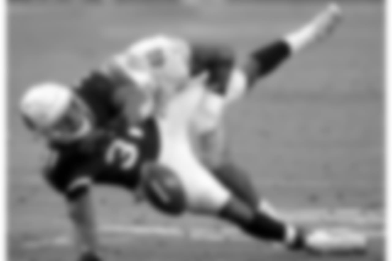 Arizona Cardinals running back David Johnson (31) is hit by Detroit Lions middle linebacker Jarrad Davis (40) for an incomplete pass during the first half of NFL football game, Sunday, Dec. 9, 2018, in Glendale, Ariz.