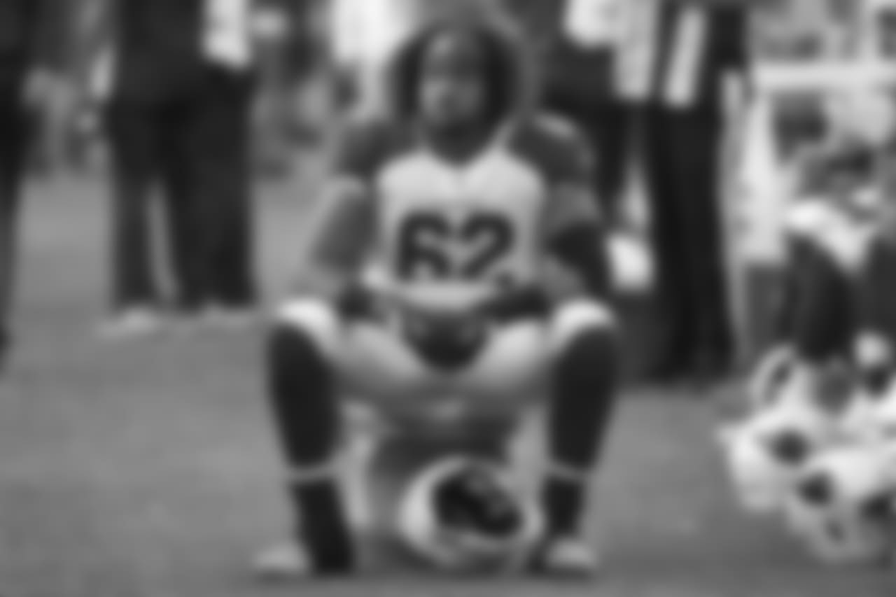 Arizona Cardinals center Daniel Munyer sits on the sideline during the first half of an NFL football game against the Minnesota Vikings, Sunday, Oct. 14, 2018, in Minneapolis.