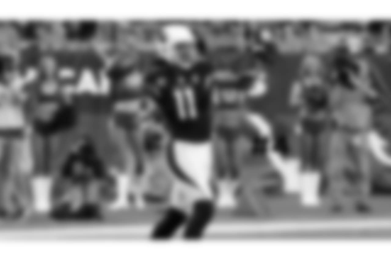 4\. WR Larry Fitzgerald throws the football to the sideline to commemorate the most catches with one team in NFL history