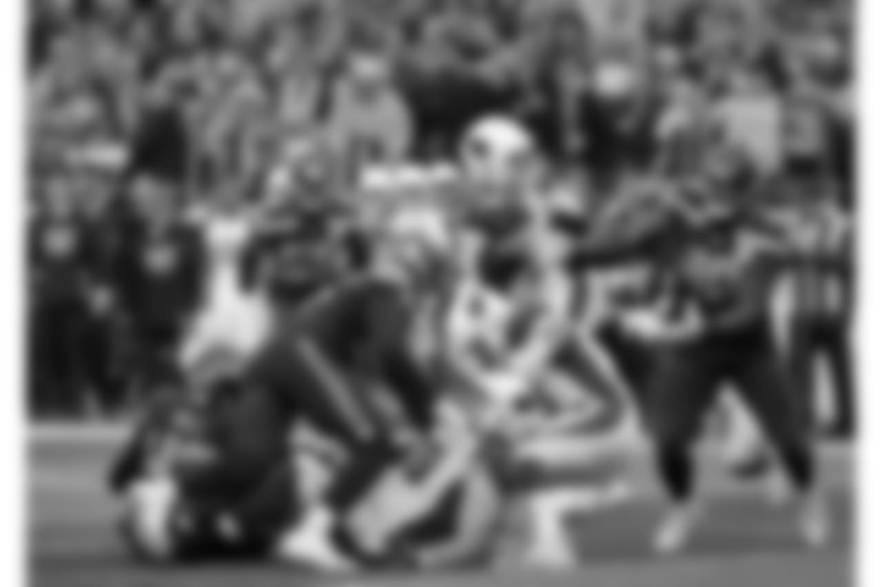 Players eye a loose ball fumbled by the Arizona Cardinals during the second half of an NFL football game against the Seattle Seahawks, Sunday, Dec. 30, 2018, in Seattle. The Seahawks recovered on the play.