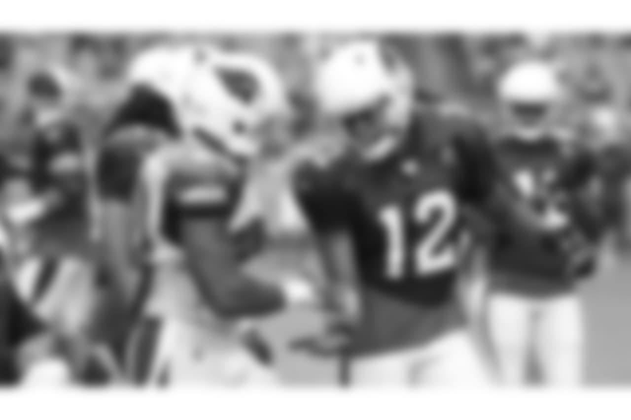 LB Deone Bucannon (left) and WR Brice Butler slap hands after a collision
