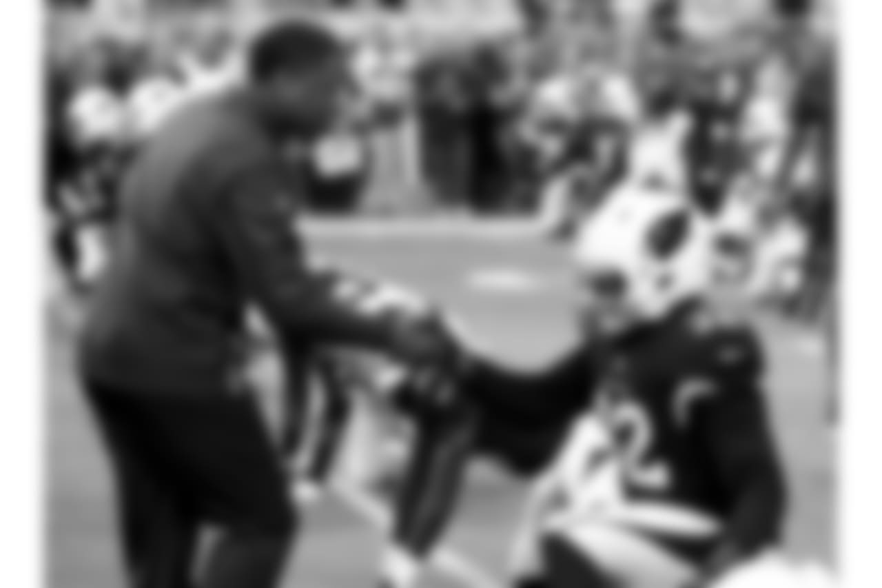 Arizona Cardinals head coach Steve Wilks greets his players prior to an NFL football game against the Detroit Lions, Sunday, Dec. 9, 2018, in Glendale, Ariz.