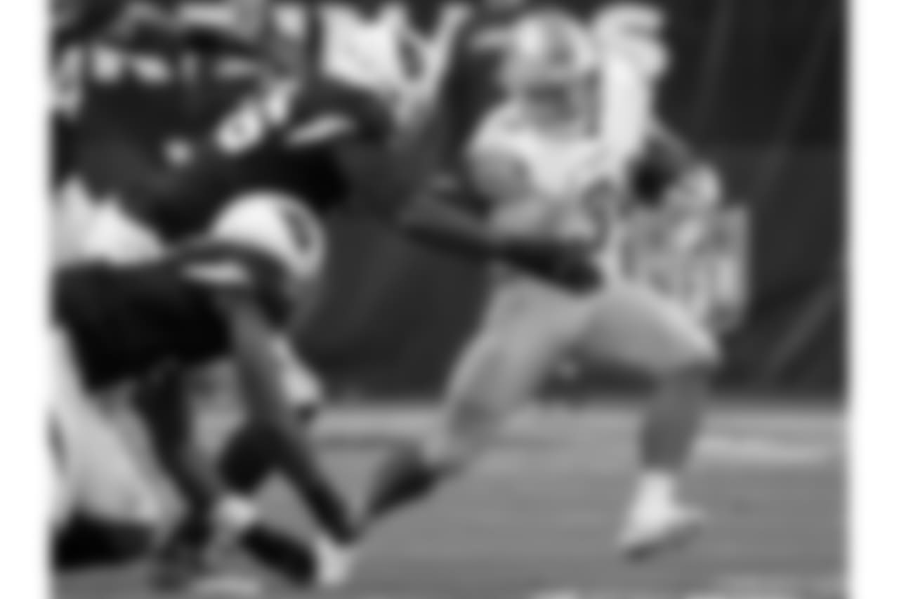 Detroit Lions running back Zach Zenner (34) tries to elude Arizona Cardinals defensive end Zach Moore (56) during the first half of NFL football game, Sunday, Dec. 9, 2018, in Glendale, Ariz.
