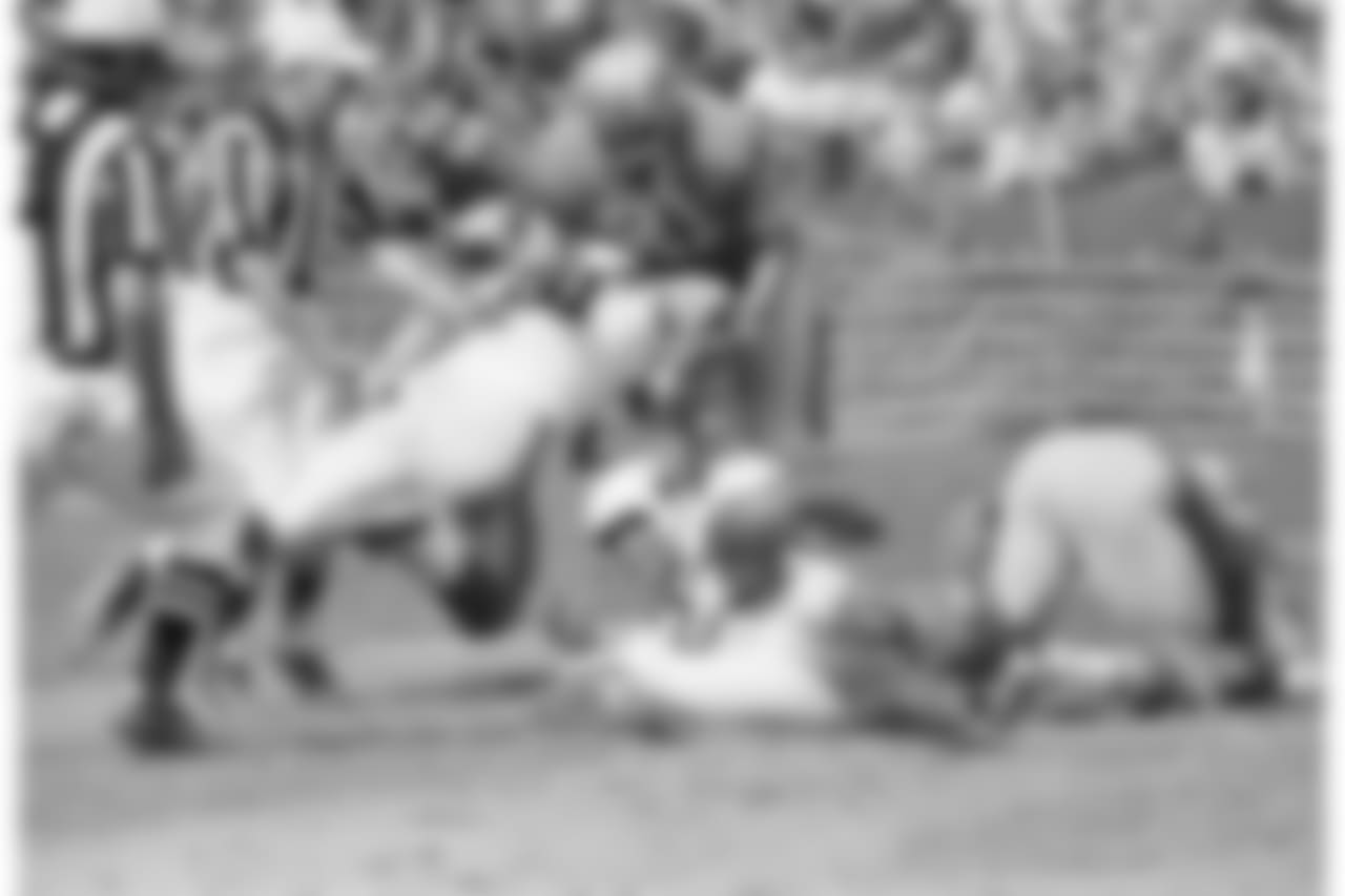A Jim Hart pass to Johnny Holand (23) was good for 35 yards in the first quarter Sunday, Oct. 1, 1967 in a game between the Cardinals and Detroit. The Cardinals' Jackie Smith throws a block at Bruce Maher of the Lions. St. Louis won 38-28.