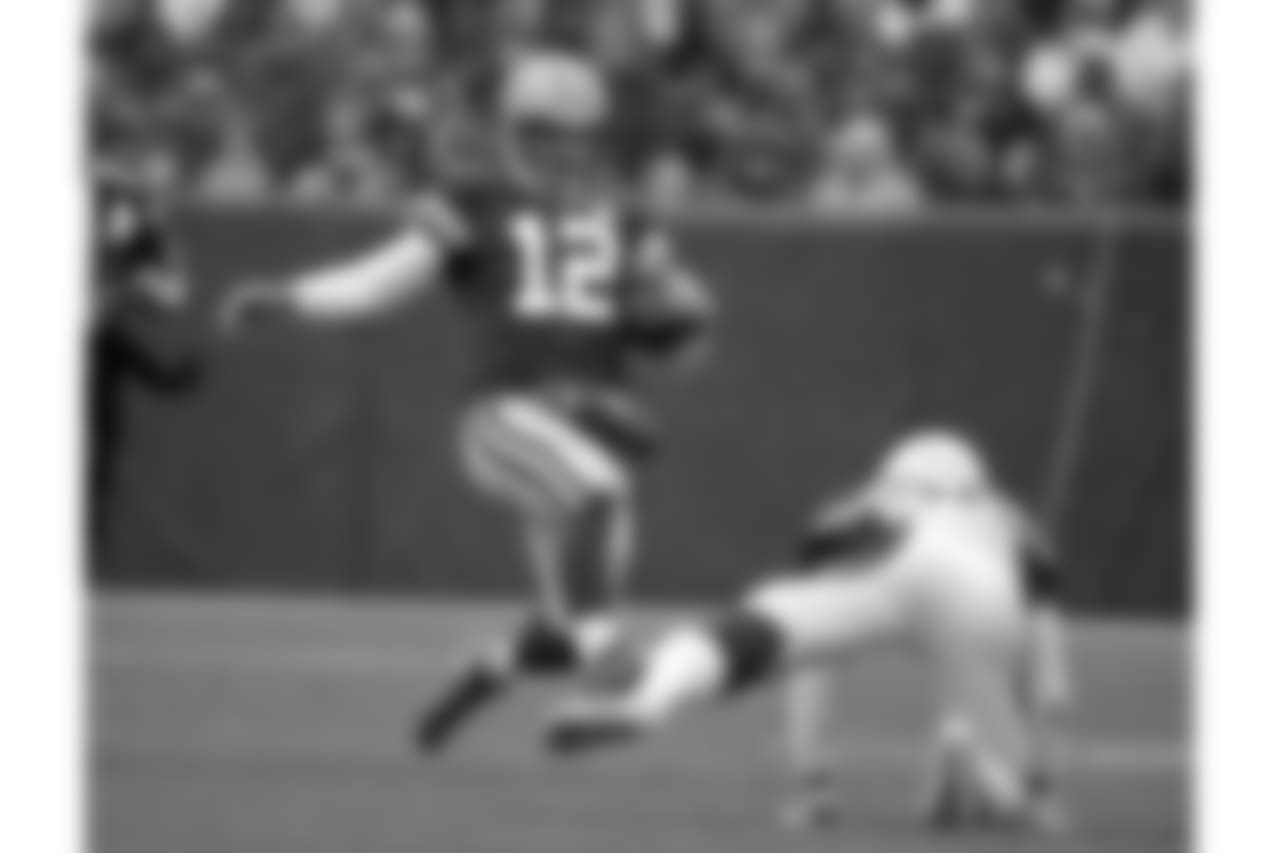 Green Bay Packers quarterback Aaron Rodgers slides to down the ball against the Arizona Cardinals during the first half of an NFL football game Sunday, Dec. 2, 2018, in Green Bay, Wis.
