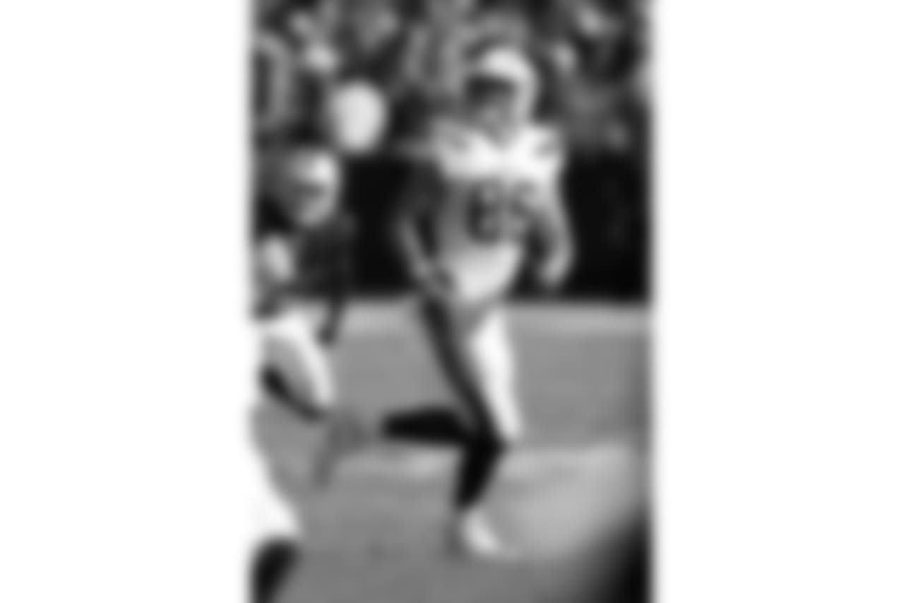 Hunter Henry looks back to catch a 23-yard pass for a first down vs. the Oakland Raiders at Oakland Alameda Coliseum on Sun. Oct. 15, 2017
