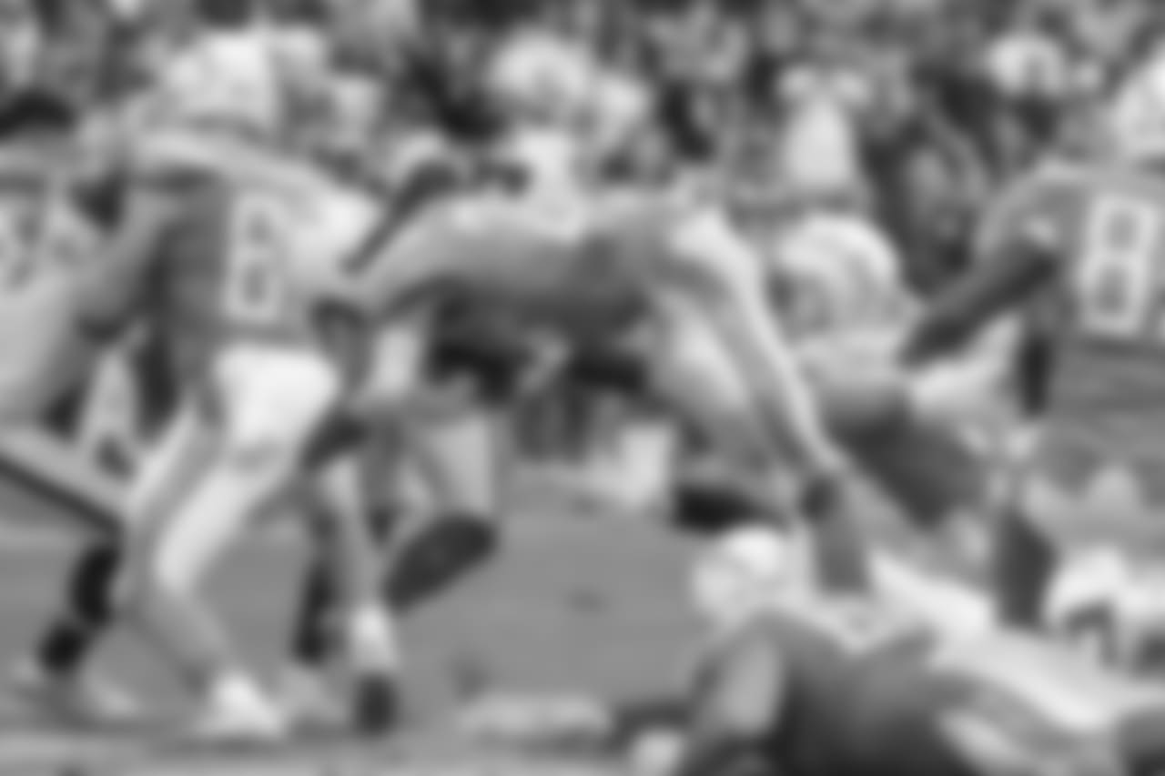Melvin Gordon dives over defenders during the Bolts' Week 5 matchup against the Oakland Raiders at ROKiT Field at StubHub Center.