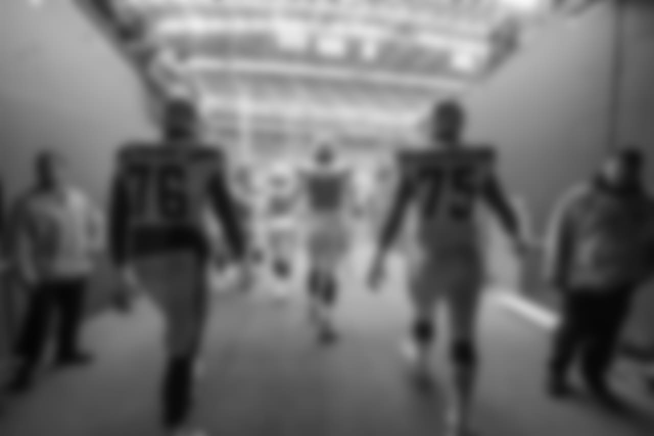 Russell Okung and Michael Schofield walk through the tunnel out to the field before the Week 9 matchup against the Seattle Seahawks at CenturyLink Field.