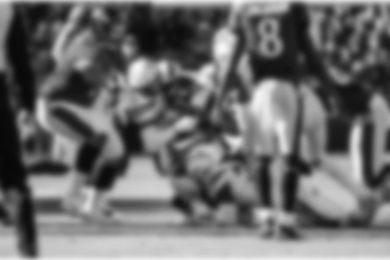 Adrian Phillips tackles RB Kenneth Dixon during the Wild Card matchup against the Baltimore Ravens at M&T Bank Stadium.